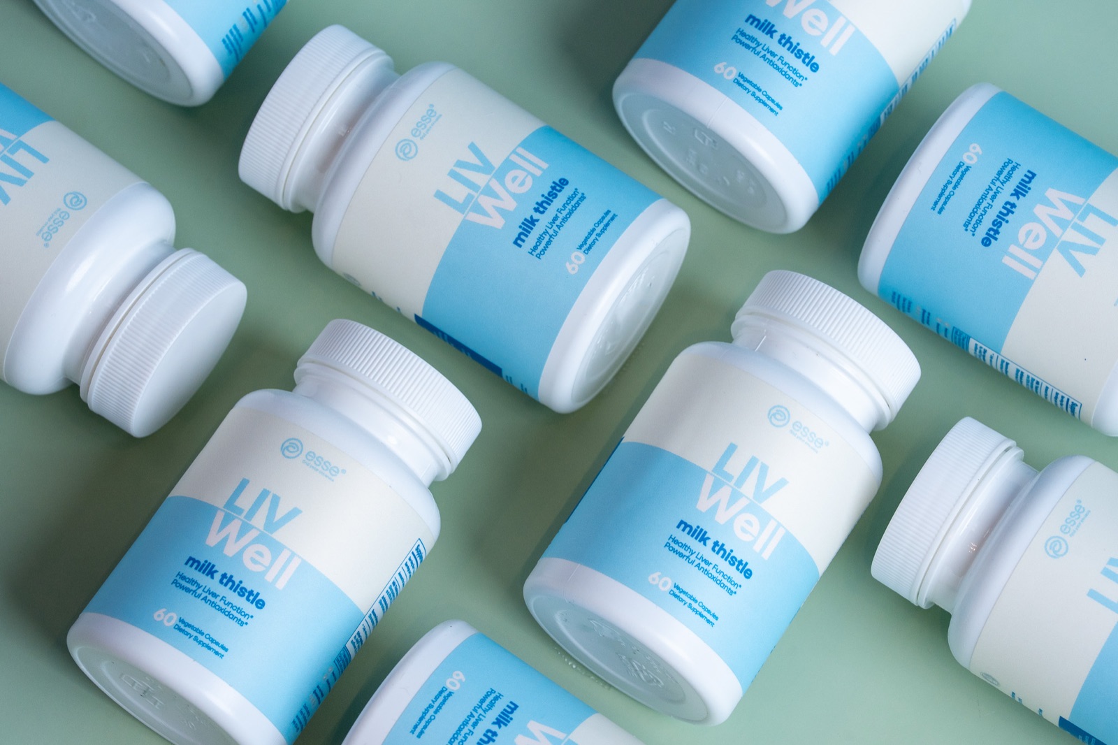 Esse Liv Well supplement flatlay product photography Miami
